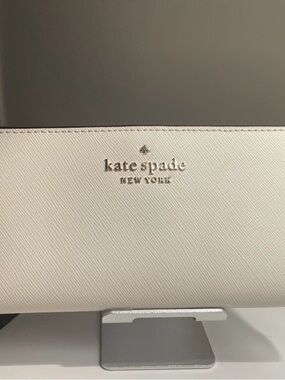 kate spade cream saffiano leather wallet with gold logo